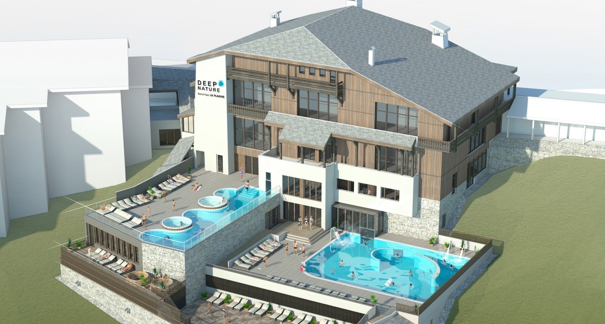 Vue extérieure sur un complexe bien-être proposant plusieurs piscines et bassins de relaxation ainsi que des aires de détente sur des terrasses